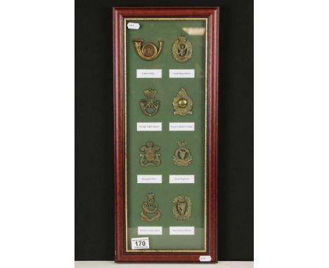 A Framed And Glazed Collection Of Eight British Military Cap Badges To Include The Queens County Rifles, Donegal Militia, Arm