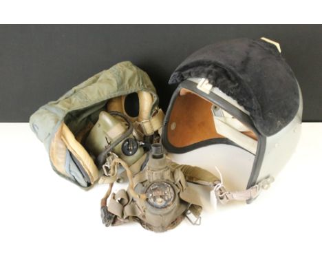 Two Royal Air Force Flying Helmets To Include A Cloth Examples Together With Two Face Masks, All Pieces Broad Arrow Marked. 
