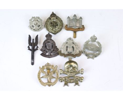 A Small Collection Of British Military Cap Badges To Include The Cambridgeshire Regiment, The Tank Corps, Glider Regiment, Ro