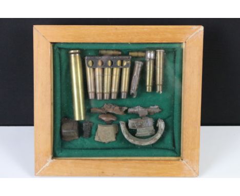 A Framed And Glazed Collection Of World War Two Inert Ammunition And Battlefield Relics. 