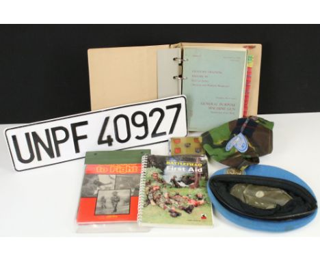 A Small Collection Of Mixed Militaria To Include United Nations Cap, 7.62 SLR Manual, Battlefield First Aid Book, Number Plat