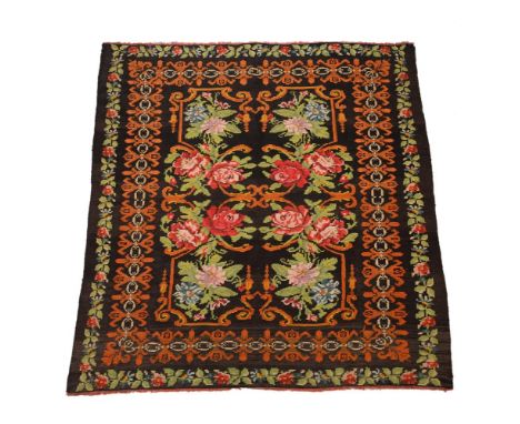 A floral flatweave rug, first half 20th century, woven with roses and flowers, polychrome floral spandrels, approximately 218