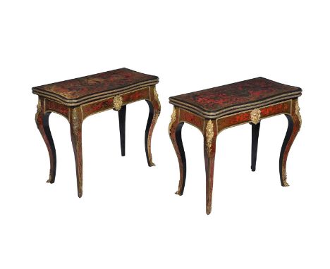 Y A near pair of Napoleon III red tortoiseshell and boule inlaid card table, circa 1870, the hinged top enclosing a circular 