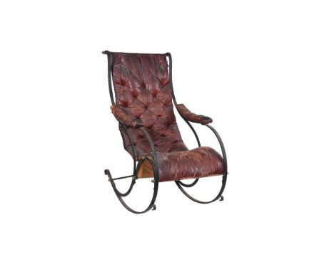 A Victorian cast iron and leather upholstered rocking armchair, second half 19th century, the brown button upholstered leathe