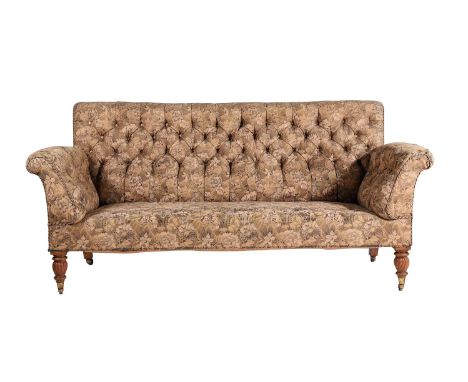 A Victorian oak and button upholstered sofa, circa 1880, the out scrolled back and arms above the seat and the wrythen carved