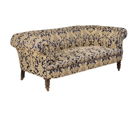 A Victorian walnut and upholstered sofa, circa 1890, of Chesterfield type and in the manner of Howard & Sons, 74cm high, 195c