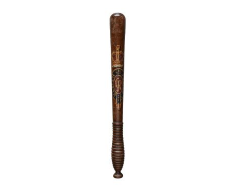 A Victorian Scottish carved oak truncheon, the turned shaft tapered to the ribbed grip and decorated with crown above V. R cy