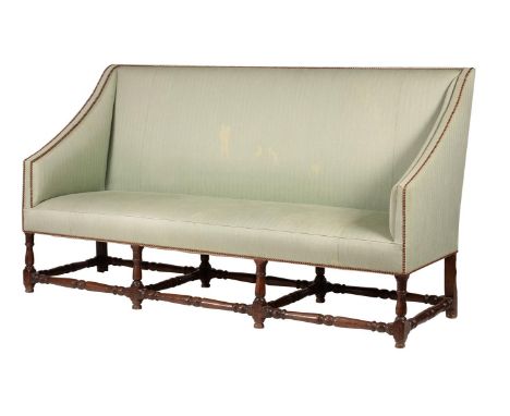An oak and upholstered sofa, late 17th century and later, 113cm high, 201cm wide, 62cm deep 