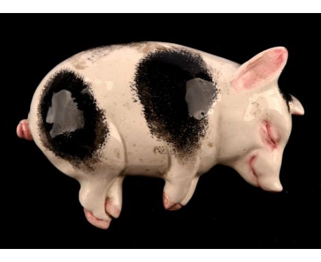 Wemyss Ware " Sleeping Pig ", impressed marks, signed B. Adams, marked  Exon 730, 17cm lengthCondition Report:  Craquelure to