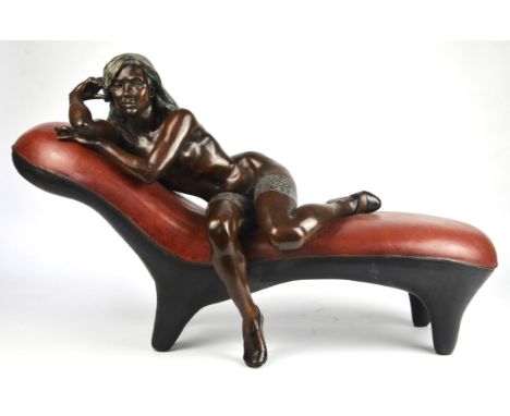 Ronald Cameron, ( British,1930-2013). The Minx on the red sofa, bronze and patinated bronze, edition of 6, 47cm high x 75cm w