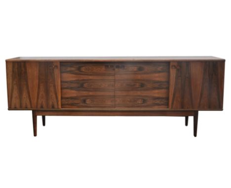 Johannes Andersen for Christian Linneberg, a rectangular sideboard, rosewood and oak, with two pairs of sliding doors, concea