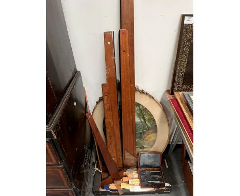RULERS, A GEOMETRY SET, MAHOGANY T SQUARES AND AN OVAL LANDSCAPE PRINT