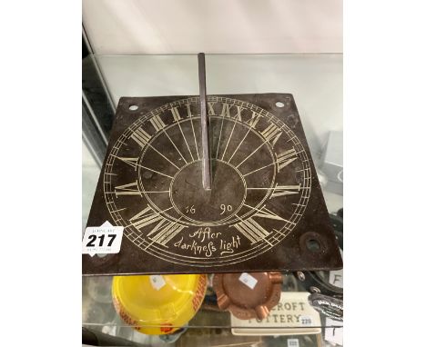 AN ANTIQUE BRASS SUNDIAL. 