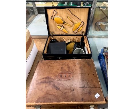 TWO VINTAGE LEATHER DRESSING CASES TOGETHER WITH EBONY AND OTHER DRESSING TABLE ITEMS. 