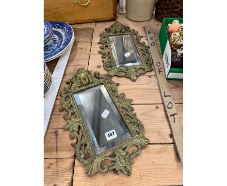 A PAIR OF VINTAGE CAST BRASS FRAMED WALL MIRRORS