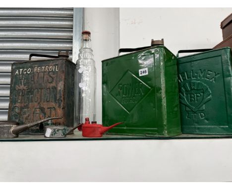 THREE VINTAGE FUEL CANS, THREE OIL CANS AND A BOTTLE. 