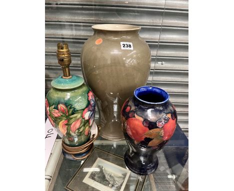 AN UNUSUAL MOORCROFT LARGE VASE OF PLAIN OLIVE COLOUR, TOGETHER WITH A VINTAGE POMEGRANATE DESIGN VASE, AND A TABLE LAMP BASE