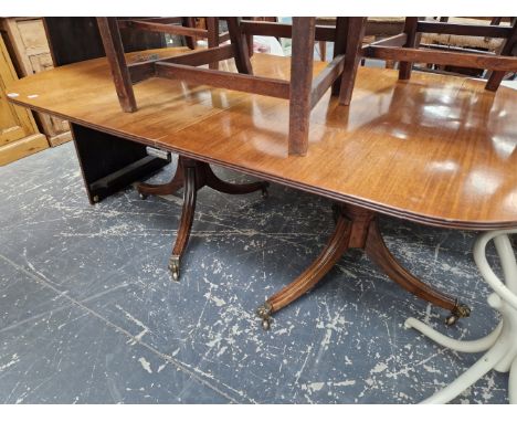 A VINTAGE SOLID MAHOGANY TWIN PILLAR DINING TABLE WITH SINGLE LEAF 