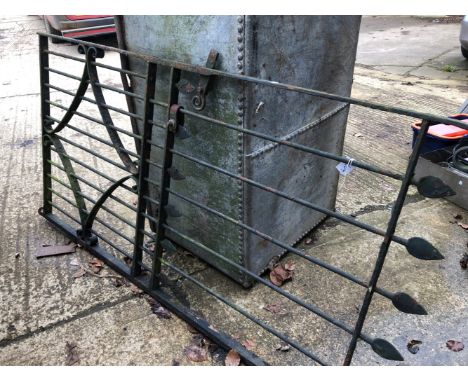 A LARGE WROUGHT IRON GATE.
