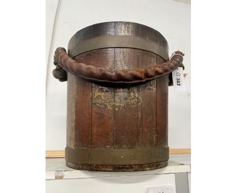 A VINTAGE TEAK AND BRASS BOUND BUCKET WITH MAKERS TAG, MADE FROM TIMBERS OF BATTLE SHIPS. CIRCA WWII. 