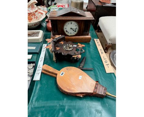 A CUCKOO CLOCK, A MANTEL CLOCK AND A PAIR OF FIRE BELLOWS
