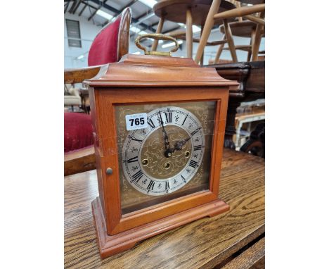 A MAHOGANY CASED MANTEL CLOCK 