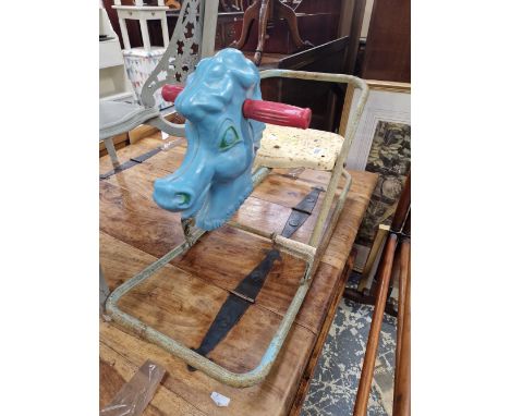 A VINTAGE TIN PLATE CHILDS ROCKER