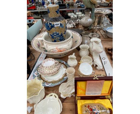 A COLLECTION OF GREEN AND BROWN MARKED BELLEEK, A PARROT CANDLESTICK, A CHINESE SNUFF BOTTLE AND A CRACKLE WARE VASE.