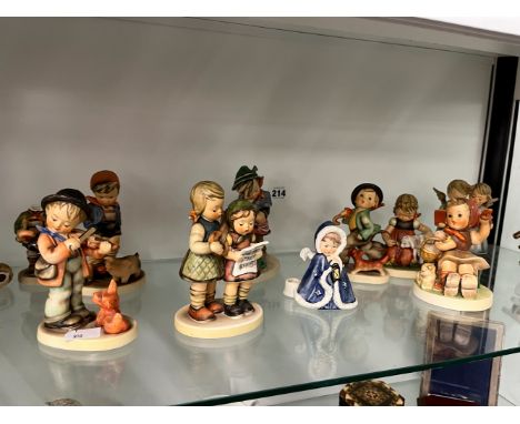 A GROUP OF 11 GOEBEL, HUMMEL FIGURES. 