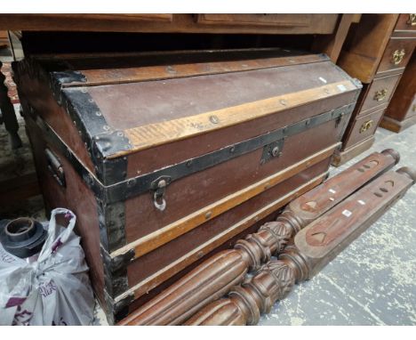 AN ANTIQUE DOMED TOP CABIN TRUNK.