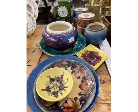 A MOORCROFT CLOCK TOGETHER WITH SEVEN OTHER MOORCROFT WARES AND TWO CANNISTERS OF TEA