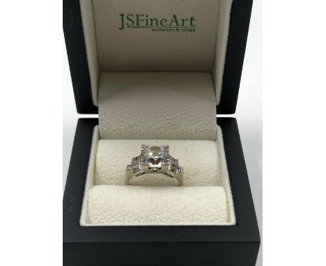 A 14K STAMPED ART DECO STYLE RING SET WITH CUBIC ZIRCONIAS, ASSESSED AS 14ct WHITE GOLD. WEIGHT 5.4grms. 