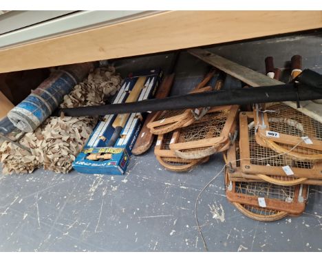 A QUANTITY OF VINTAGE TENNIS RACQUETS AND CRICKET BATS AND CAMOUFLAGE NETTING 