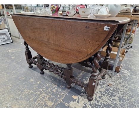 A LARGE 18th C. OAK GATE LEGGED TABLE 