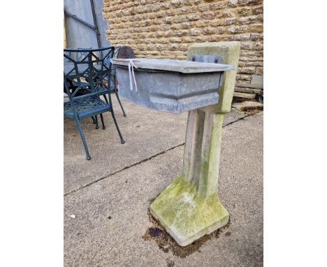 A VINTAGE LITTER BIN ON CONCRETE STAND