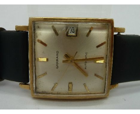 A gentleman's 9ct gold, square cased Garrard wristwatch, lacking button, case back bears inscription dated 1976
