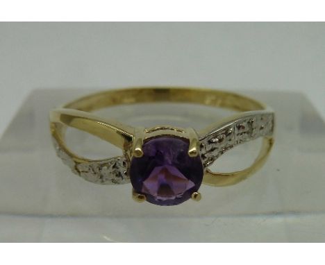 A 9ct gold, amethyst and diamond ring, weight 1.0g, size O