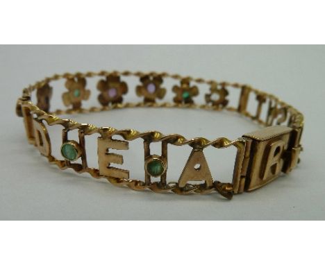 A 9ct gold Dearest bangle set in order with Diamond, Emerald, Amethyst, Ruby, Emerald, Sapphire and Topaz, weight 11.2g