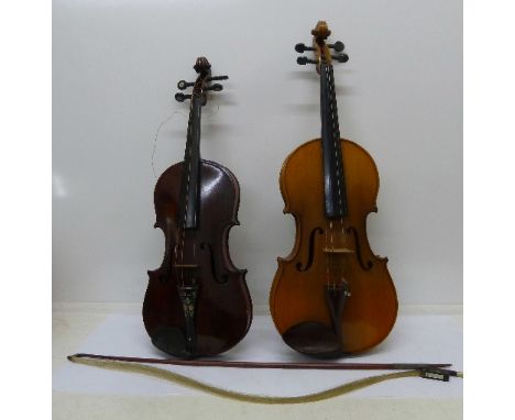 Two violins and a viola, the first with paper label marked Joseph Guarnerius, length of back 36.5cm, inlaid with mother of pe