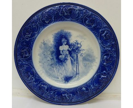 A blue and white charger with transfer print of a maiden, diameter 36cm
