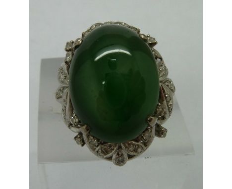 A platinum, diamond and jade ring, weight 11.2g, size H