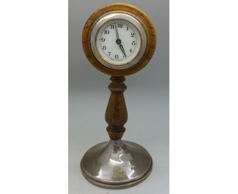 A German desk clock with silver base and bezel, height 23cm