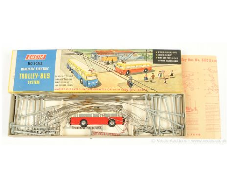 Eheim (HO) 6102 Trolley-Bus System containing red and white 4-wheel Single Deck Trolley-Bus with pantograph to front of roof,
