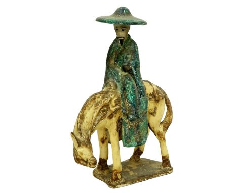 Chinese Tang Dynasty Style Polychrome Pottery Figure on Horseback. Measures 13" H x 9-1/2" W. Condition: Crazing and rubbing 