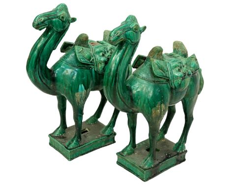 Pair of Chinese Tang Dynasty Style Green Glaze Pottery Camel Figures. Export seal stamp to one figure. Measures 17-1/8" H x 4