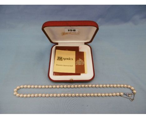 A Majorca pearl necklace with silver clasp in its original box