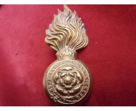 The Royal Fusiliers (City of London Regiment) Other Ranks Head Dress Badge for the Raccoon-skin cap, second type (Brass) two 