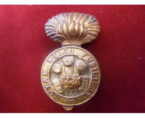 The Royal Welsh Fusiliers WWI Cap Badges, three variations (Bi-metal, Brass-economy and White-Metal), Sliders and lugs, worn 