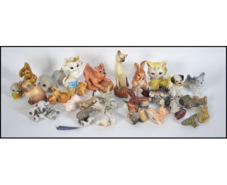 A collection of vintage wade figures and similar together with some SylvaC ceramic animal figures please see images.