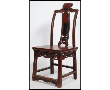 A 19th century Chinese laquered horseshoe chair having panel seat over squared legs united by peripheral stretcher and pierce